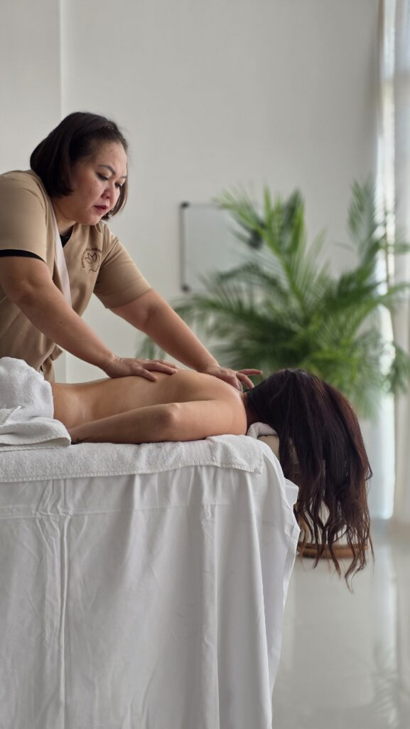 Empress therapist giving a full body Balinese massage at home