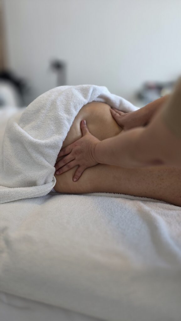 Side lying lower back massage, a position used for prenatal clients