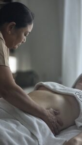 Lymphatic drainage in dubai on stomach of client