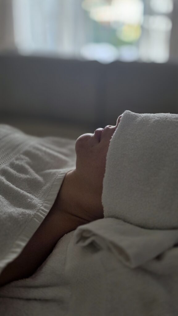 Client sleeping peacefully during a Balinese massage at home