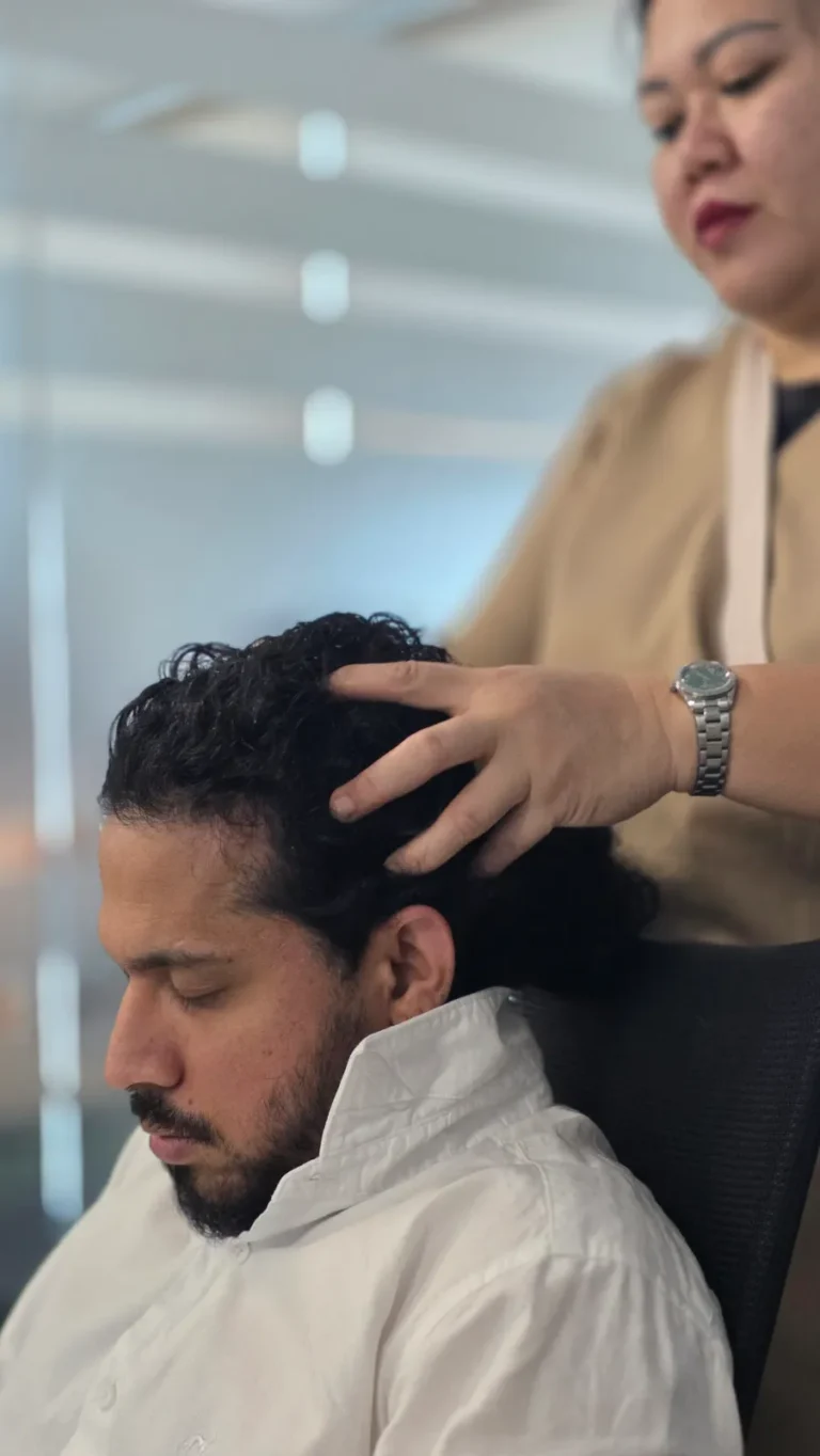 Corporate chair massage for a team member at an office in Dubai