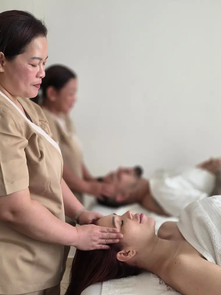 Two Empress Balinese therapists giving a couples massage at home in Dubai