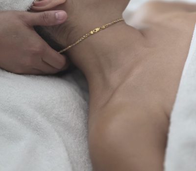Empress therapist doing a neck massage on stiff neck